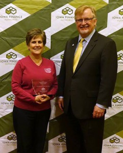 Vicky Halvorsen accepting her award from IFA Executive Director Dave Jamison at the Iowa Finance Authority Luncheon on March 10th.