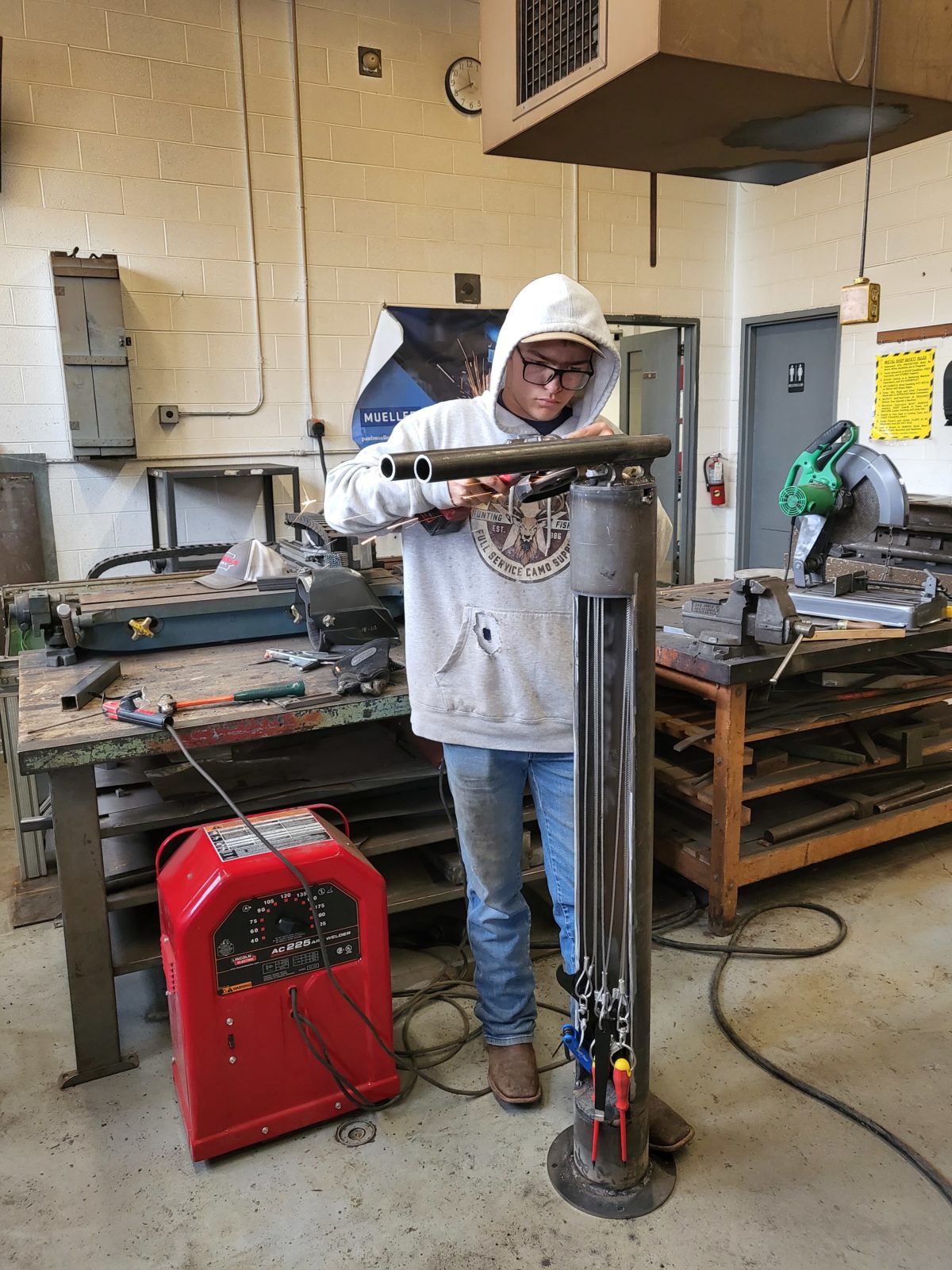 Student fabricating bike repair station